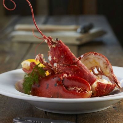 Crab House Cafe - Whole Dorset steamed Lobster in white wine, paprika, lemon and thyme, flamed in Somerset cider brandy. Crab House Cafe - Whole Dorset steamed Lobster in white wine, paprika, lemon and thyme, flamed in Somerset cider brandy.